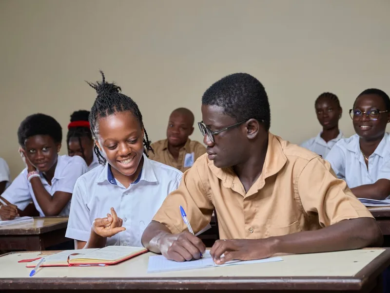 Secondary school students collaborating in class